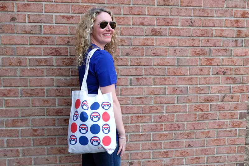 Woman wearing cat tote bag