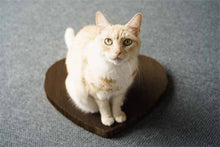 Load image into Gallery viewer, Cat lounging on heart shaped cat scratcher
